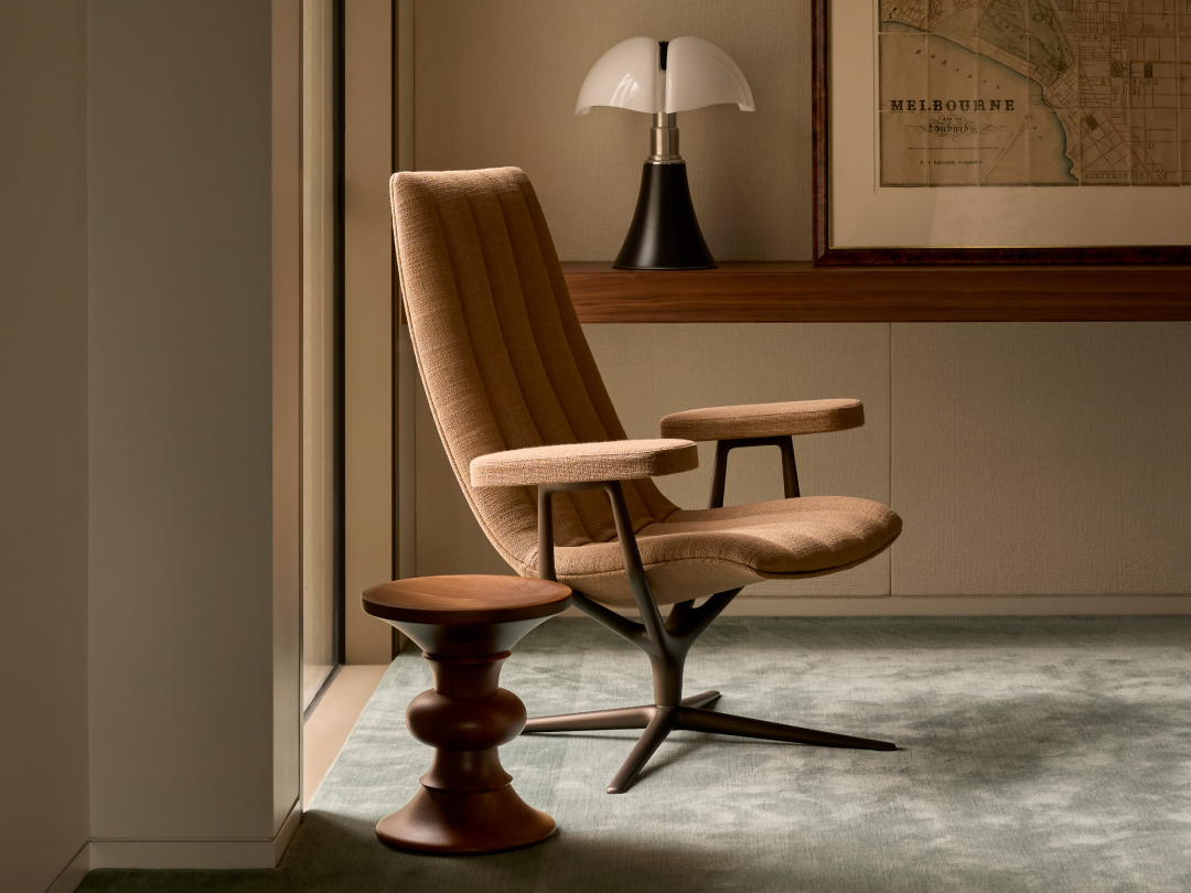 Healey Lounge Chair by Walter Knoll featuring an upholstered seat, enveloping shell and swivel base.