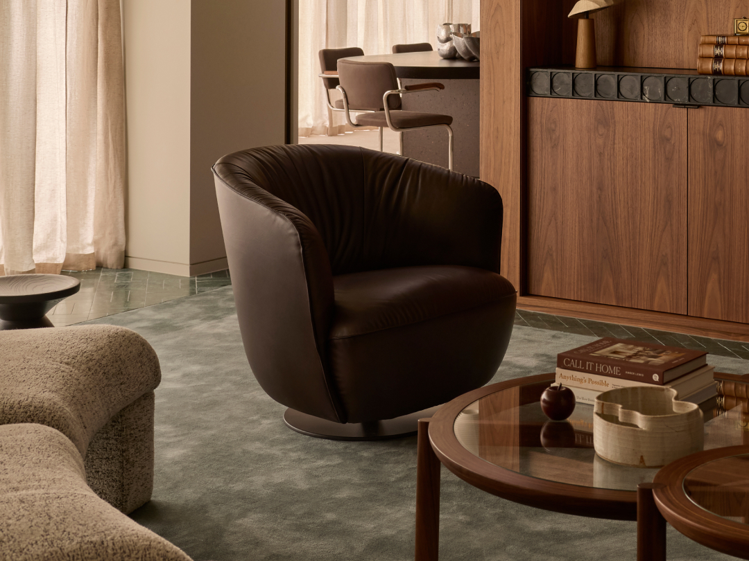Ishino Armchair by Walter Knoll, with rounded contours and softly tailored upholstery.